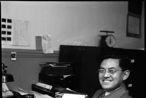 Man seated at desk (ddr-densho-426-953)