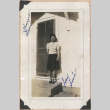Signed photograph of a woman on a porch (ddr-manz-10-9)