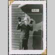 Man holding gloves (ddr-densho-434-338)