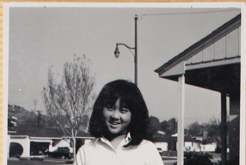 Girl standing outside house (ddr-densho-522-127)