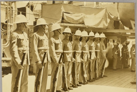Uniformed soldiers with guns on board the HMS Achilles (ddr-njpa-13-470)
