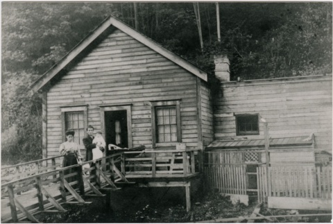 Family in front of house (ddr-densho-353-24)
