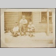 Three brothers in front of their house (ddr-densho-259-7)