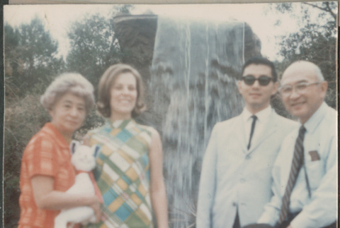 Chester and Agnes Sakura with son, daughter-in-law and grandson by fountain (ddr-densho-523-467)