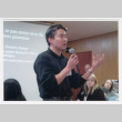 Tom Ikeda speaking at the Global Classroom program (ddr-densho-506-38)