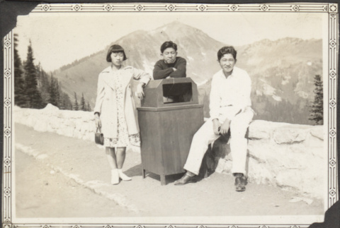 Three people and a trash can (ddr-densho-326-613)