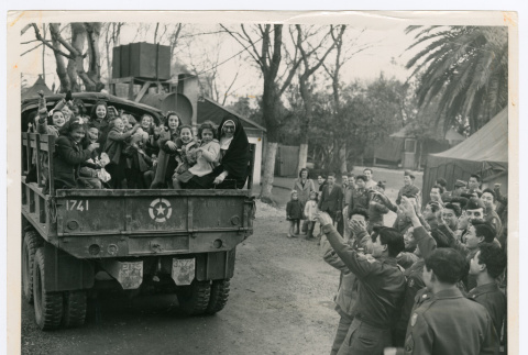 Orphan children leaving Company G's Christmas party (ddr-densho-1007-366)