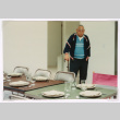 Takeo Isoshima in dining room (ddr-densho-477-674)