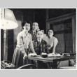 Group photo around a desk (ddr-densho-494-11)