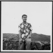Nise man poses at lookout (ddr-densho-363-291)