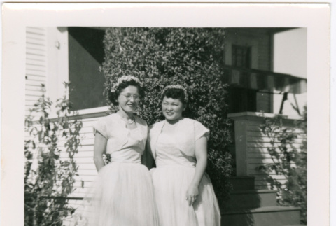 Two women in bridesmaid's dresses (ddr-densho-458-14)