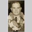 A man wearing leis (ddr-njpa-1-1405)