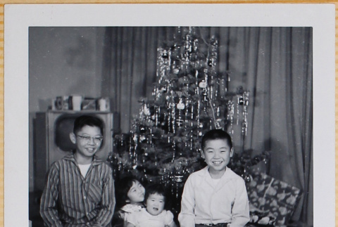 William, Leslie and Susan Shiomi with unidentified boy (ddr-densho-522-531)