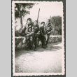 Four Soldiers pose on wall (ddr-densho-368-566)