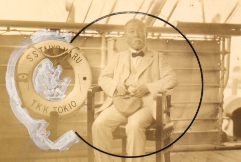 Man seated on Taiyo Maru deck (ddr-njpa-4-223)