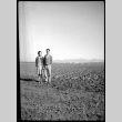 Young man and woman in an empty field (ddr-densho-475-148)