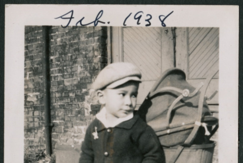 Photo of a child next to a pram (ddr-densho-483-715)