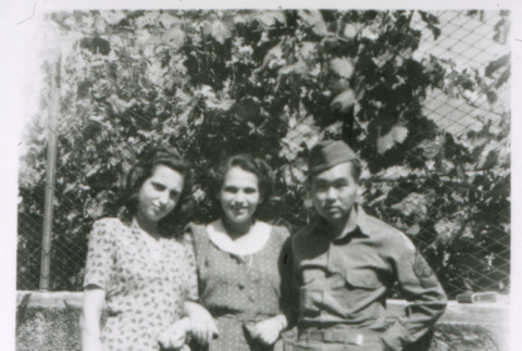 Soldier with two women (ddr-densho-1007-874)