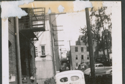 School bus in dirt alleyway (ddr-densho-483-1014)