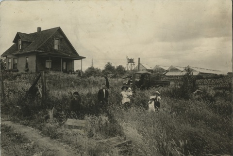 Family in front of home (ddr-densho-134-37)