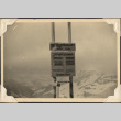 Ski lift sign on mountaintop (ddr-densho-466-802)