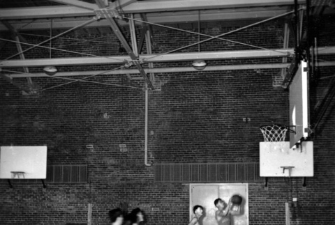 Men playing basketball (ddr-ajah-5-34)