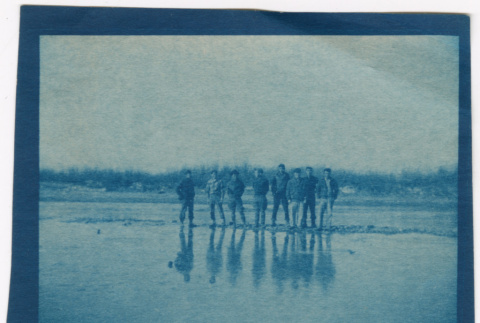 Eight men standing in muddy field (ddr-densho-329-1383)