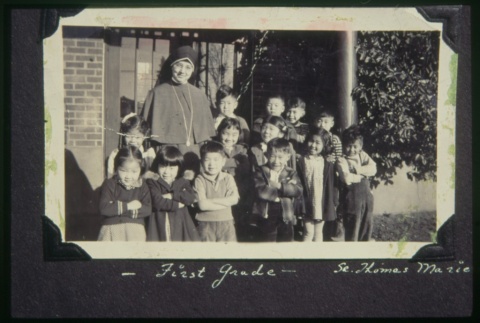 Nun and children outside of building (Maryknoll) (ddr-densho-330-27)