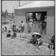 Young Japanese Americans waiting for new arrivals (ddr-densho-151-256)