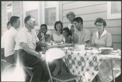 Family at backyard picnic (ddr-densho-523-359)