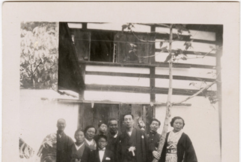 Group standing outside house (ddr-densho-426-50)