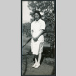 Photograph of a nurse posing in front of a tree at Manzanar (ddr-csujad-47-190)