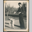 Dog performing tricks for treats (ddr-densho-433-764)