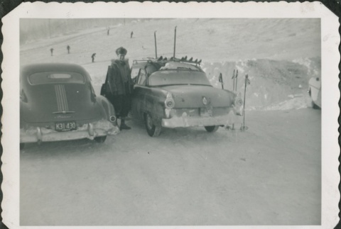 Man near a car with ski equipment (ddr-densho-321-344)