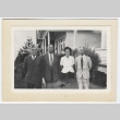 Four people outside a house (ddr-densho-259-678)