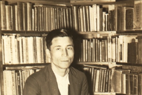Ichiro Numata posing with books (ddr-njpa-4-1532)