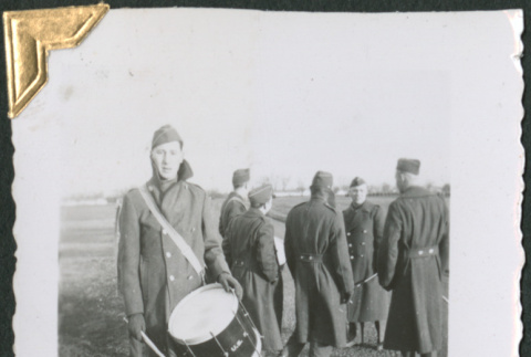 Man with drum with group in background (ddr-densho-434-53)