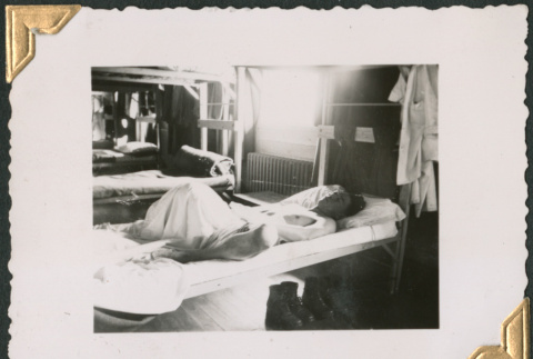 Man sleeping on cot (ddr-densho-434-162)