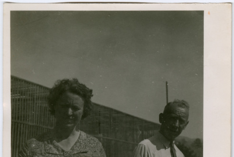 Man and woman by building (ddr-densho-329-738)