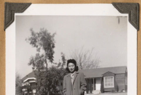 Woman standing on a path (ddr-densho-542-84)