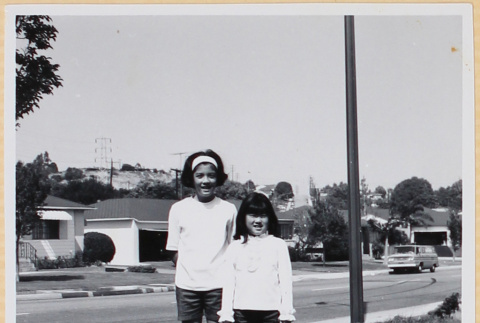 Two girls standing in yard (ddr-densho-522-105)