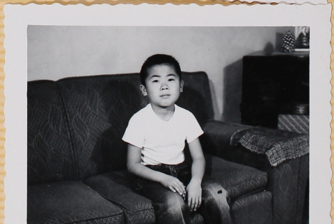 William Shiomi sitting on couch (ddr-densho-522-188)