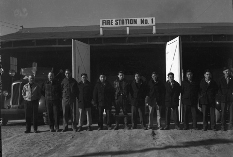 Firemen standing in front of Fire Station No. 1 (ddr-fom-1-755)