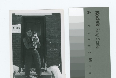 Man holding dog (ddr-densho-255-62)