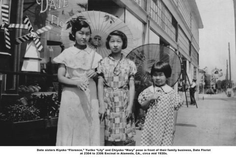 Three girls outside florist shop (ddr-ajah-6-378)