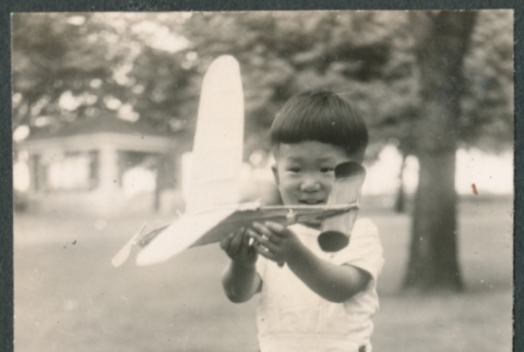 Boy with model plane (ddr-densho-523-205)