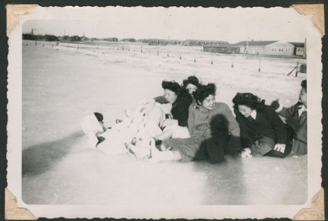Ice skaters falling down (ddr-densho-463-111)