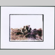 Two men sitting surrounded by rocks (ddr-densho-423-457)