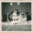 Henri Takahashi and Tomoye (Nozawa) Takahashi at head table with wedding cake (ddr-densho-410-499)