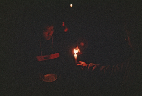 Campers lighting candles on the last night of camp (ddr-densho-336-1628)